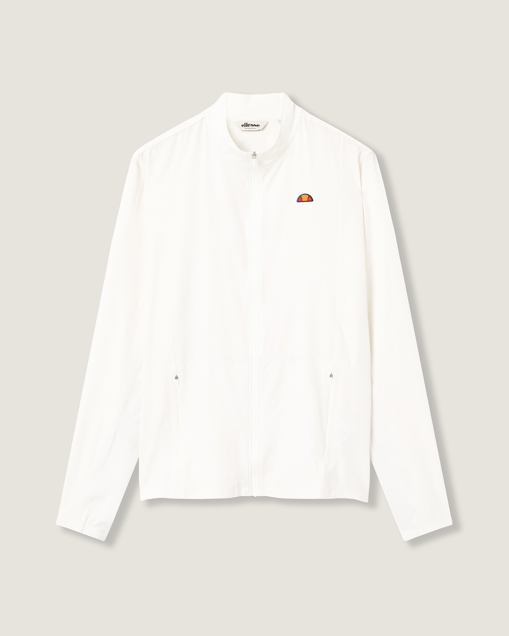 White shirt with a small logo on a light gray background
