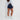 Ellesse US - Women's Giuseppa Short - Navy. Back view on model.